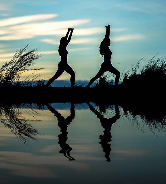 women, yoga, silhouettes, water, reflection, mirroring, water reflection, pose, posing, yoga pose, meditation, stretching, wellness, well-being, exercise, adults, nature, asia, girls, morning, outdoors, pair, people, stance, sunrise, sunset